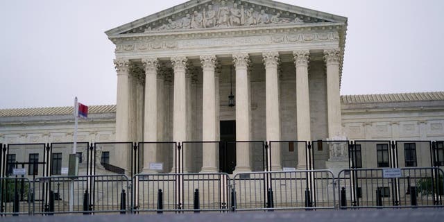 Security fencing is in place outside the Supreme Court in Washington, Saturday, May 14, 2022, ahead of expected abortion right rallies later in the day. (Photo/Pablo Martinez Monsivais)