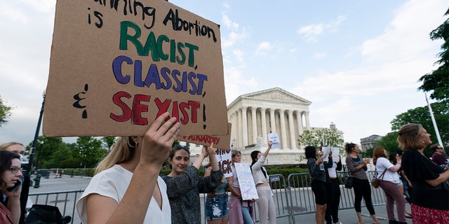 Demonstrators protest outside of the U.S. Supreme Court Wednesday, May 4, 2022 in Washington. (AP Photo/Alex Brandon)