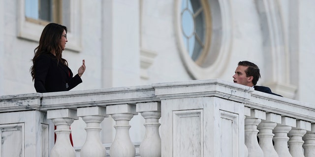 Rep. Lauren Boebert, R-Colo., and Rep. Madison Cawthorn, R-N.C., speak to one another on the steps to the U.S. Capitol on Sept. 23, 2021, in Washington. 