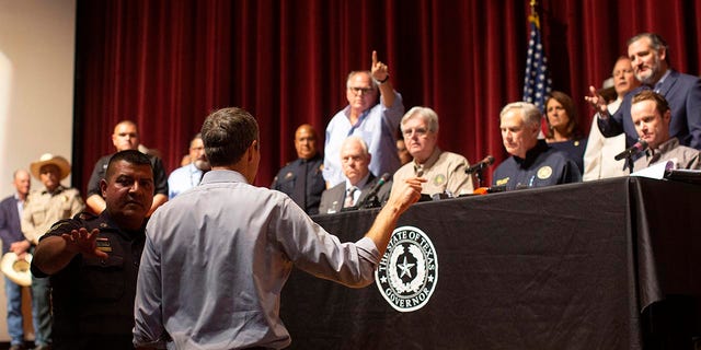 Beto O'Rourke, running against Greg Abbott for governor in 2022, interrupts a news conference headed by Texas Gov. Greg Abbott in Uvalde, Texas Wednesday, May 25, 2022. 