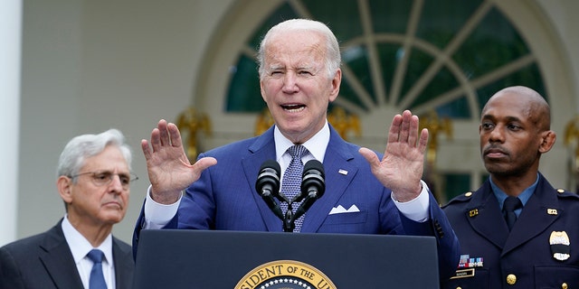 President Joe Biden speaks in the Rose Garden of the White House in Washington, Friday, May 13, 2022, during an event to highlight state and local leaders who are investing American Rescue Plan funding. Attorney General Merrick Garland, left, and Kansas City, Mo., Police Department Police Chief Joe Mabin listen. (AP Photo/Susan Walsh)