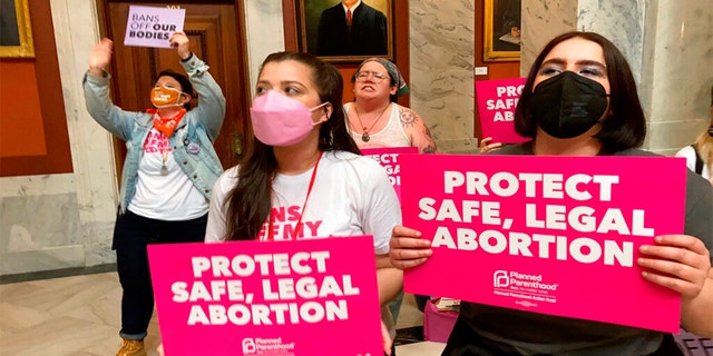 Abortion-rights supporters chant their objections at the Kentucky Capitol April 13, 2022, in Frankfort, Ky., as Kentucky lawmakers debate overriding the governor's veto of an abortion measure. 
