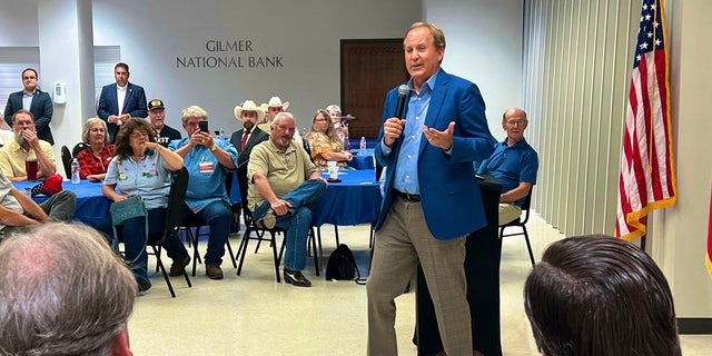 Texas Attorney General Ken Paxton campaigns in Gilmer, Texas, on May 19, 2022.
