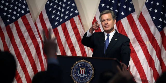 Director Christopher A. Wray speaks during a news conference at FBI Headquarters on June 14, 2018, in Washington.