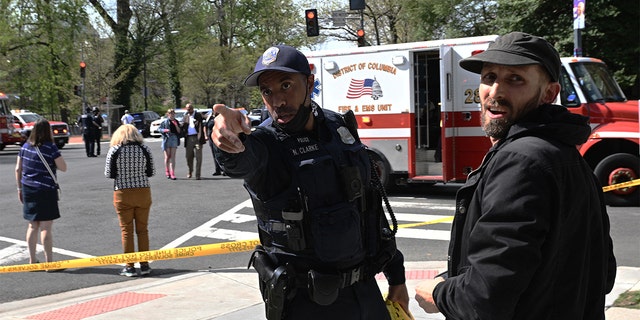 Police secure the area around the Connecticut Avenue and Tilden Street intersection after a reported shooting in Washington, D.C., on April 22, 2022.