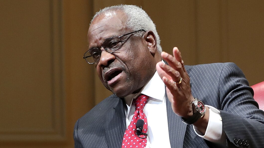 Supreme Court associate justice Clarence Thomas gestures as he speaks during an event.