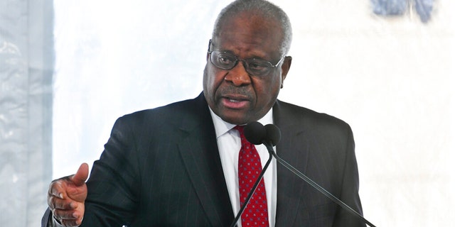 FILE - Supreme Court Justice Clarence Thomas delivers a keynote speech during a dedication of Georgia new Nathan Deal Judicial Center in Atlanta, Feb. 11, 2020.