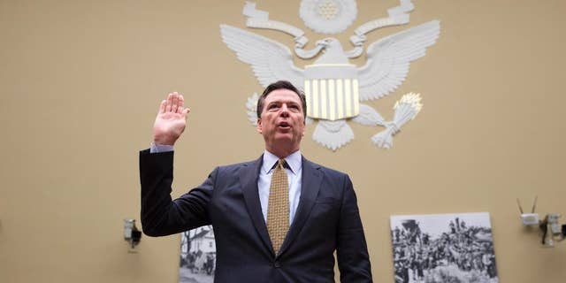 FBI Director James Comey is sworn in on Capitol Hill in Washington, Thursday, July 7, 2016, prior to testifying before the House House Oversight and Government Reform Committee hearing to explain his agency's recommendation to not prosecute  Democratic presidential candidate Hillary Clinton over her private email setup. 