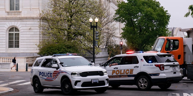 Police vehicles and heavy trucks block access to the Supreme Court building in Washington, Wednesday, May 4, 2022, as security measure are enhanced following protests sparked by news that the court might overturn Roe v. Wade.