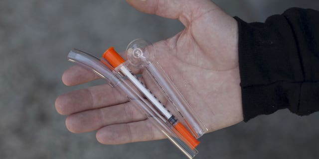 A pipe for crack cocaine use, a needle for heroin use and a pipe for methamphetamine use are shown at the People's Harm Reduction Alliance, the nation's largest needle-exchange program, in Seattle, Washington.