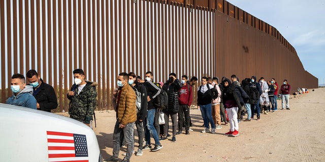 Immigrant men from many countries are taken into custody by U.S. Border Patrol agents at the U.S.-Mexico border on December 07, 2021 in Yuma, Arizona. 