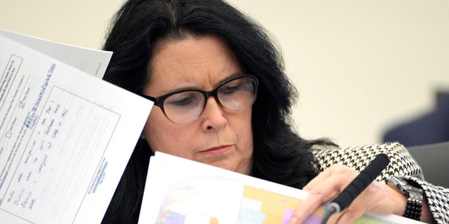 FILE: State Sen. Kelli Stargel looks through redistricting maps during a Senate Committee on Reapportionment hearing on, Jan. 13, 2022, in Tallahassee, Fla.