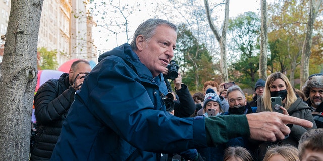 Mayor Bill de Blasio greets spectators during 95th Macy's Thanksgiving Day parade balloon inflation on West 81st street. (Photo by Lev Radin/Pacific Press/LightRocket via Getty Images)