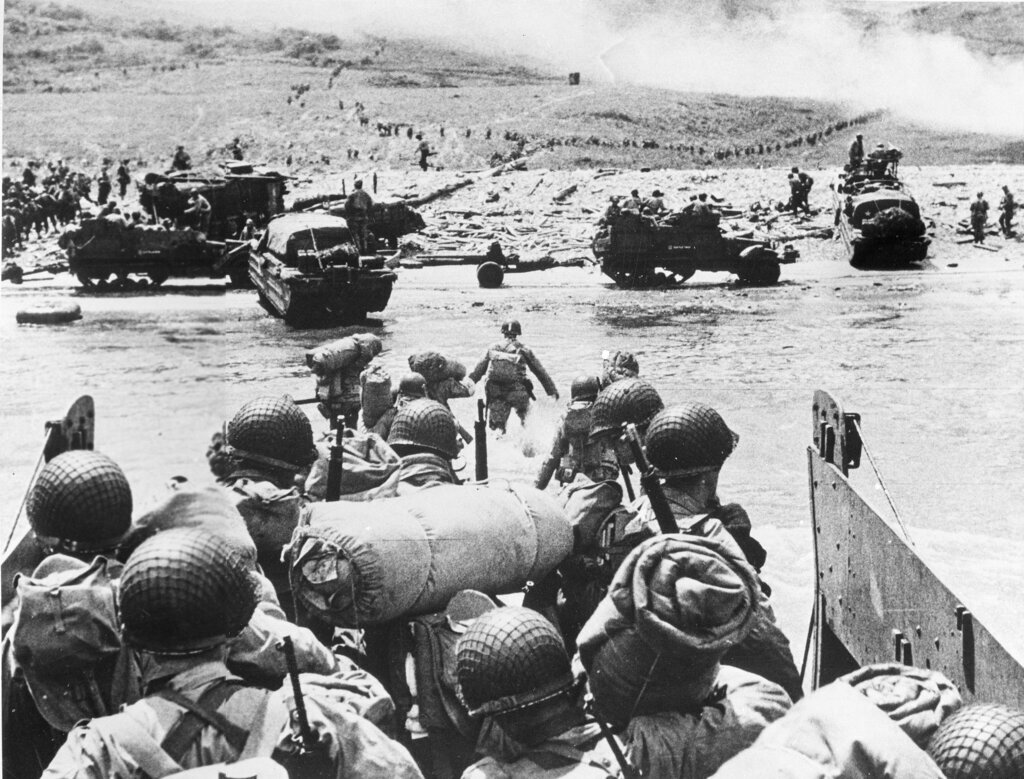 American soldiers and supplies arrive on the shore of the French coast of German-occupied Normandy during the Allied D-Day invasion on June 6, 1944, in World War II. 