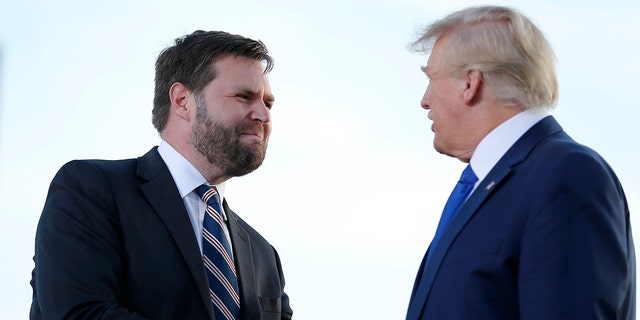 Senate candidate J.D. Vance greets former President Donald Trump at a rally at the Delaware County Fairground, April 23, 2022, in Delaware, Ohio.