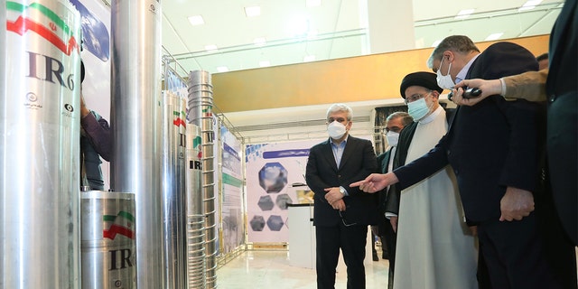 Iranian President Ebrahim Reisi participates in an exhibition organized by the Atomic Energy Organization of Iran on the occasion of the National Nuclear Technology Day at the International Conference Center in Tehran, Iran on April 9, 2022. Mohammad Eslami, Head of the Atomic Energy Organization of Iran, accompanied the Iranian president during his visit to the exhibition.