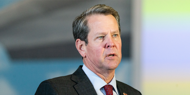 Gov. Brian Kemp speaks during a news conference at the Delta Flight Museum in Hapeville, Georgia, on Feb. 25, 2021.