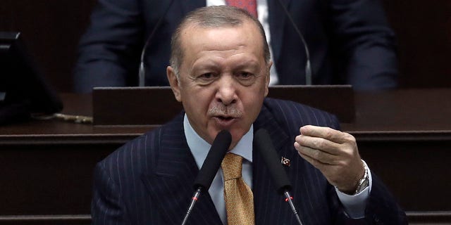 Turkey's President Recep Tayyip Erdogan addresses his ruling party lawmakers at the parliament, in Ankara, Turkey, Wednesday, Oct. 28, 2020. 