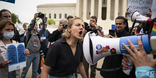 Pro-life and pro-choice demonstrators during a protest outside the U.S. Supreme Court in Washington, D.C., U.S., on Tuesday, May 3, 2022. Photographer: Al Drago/Bloomberg via Getty Images