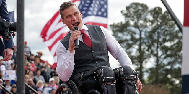 Rep. Madison Cawthorn, R-N.C., speaks before former President Donald Trump takes the stage at a rally on April 9, 2022, in Selma, N.C. 