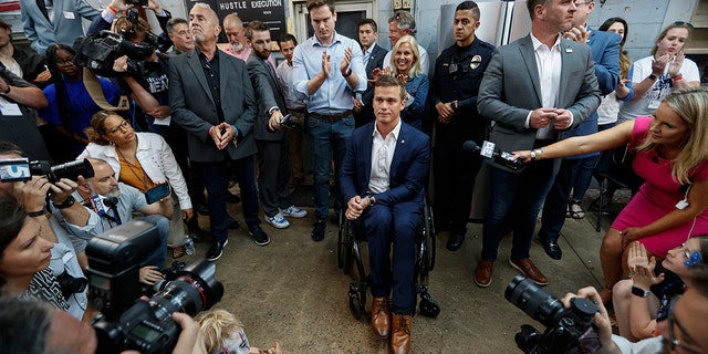 U.S. Rep. Madison Cawthorn, R-N.C., is surrounded by media as he speaks to supporters at his primary election night watch party in Hendersonville, N.C., Tuesday, May 17, 2022. 