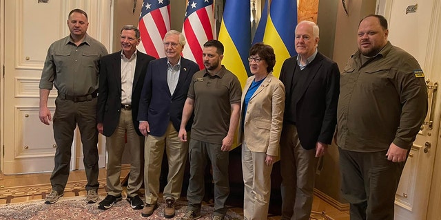 Ukrainian President Volodymy Zelenskyy takes a photo with Senate Minority Leader Mitch McConnell, Sens. John Barrasso, Susan Collins and John Cornyn, left to right, Saturday, May 14, 2022.