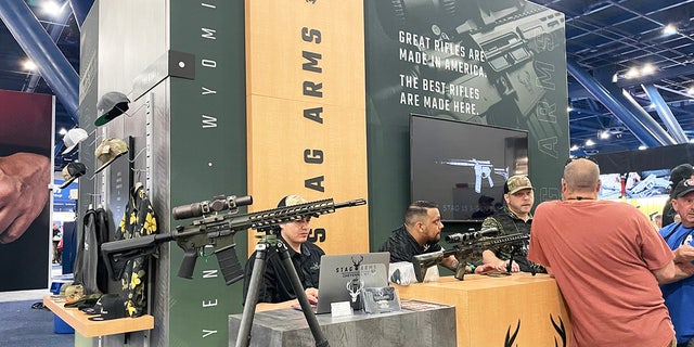 Different booths are shown on the exhibit floor of the 2022 NRA convention in Houston.