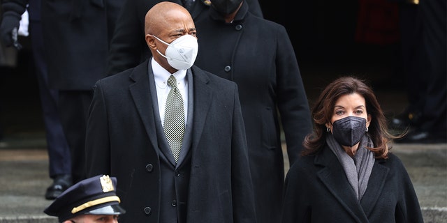 New York City Mayor Eric Adams and New York Gov. Kathy Hochul leave the funeral for fallen NYPD officer Wilbert Mora at St. Patrick's Cathedral on Feb. 2, 2022, in New York City.