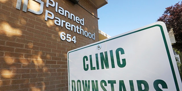 FILE - In this Aug. 21, 2019 photo, a sign is displayed at Planned Parenthood of Utah in Salt Lake City. 