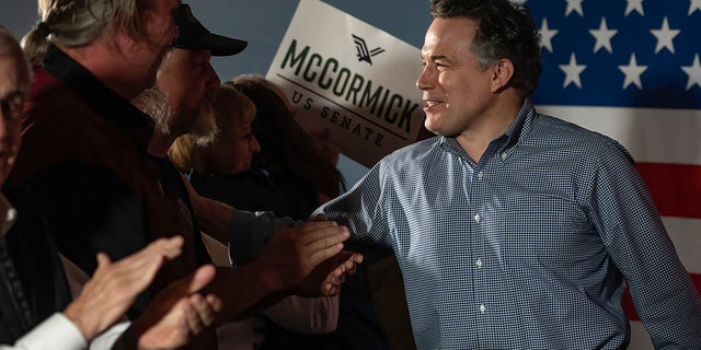 Dave McCormick shakes hands with supporters at a rally to raise support for his U.S. Senate bid. 