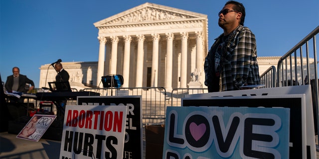 People gather at an anti-abortion rally outside of the Supreme Court in Washington, Tuesday, Nov. 30, 2021.
