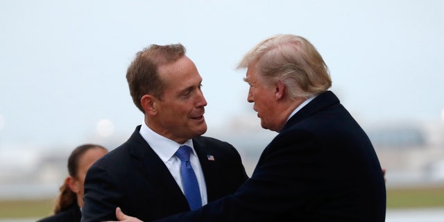 U.S. President Donald Trump greets Ted Budd, Republican candidate from North Carolina's 13th district, in Charlotte, North Carolina, U.S., October 26, 2018.  REUTERS/Kevin Lamarque