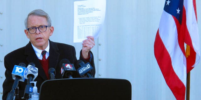 In this Nov. 18, 2020 file photo, Republican Ohio Gov. Mike DeWine discusses the most recent data on Ohio's soaring coronavirus cases during a news briefing at John Glenn International Airport on  in Columbus, Ohio. (AP Photo/Andrew Welsh-Huggins, File)