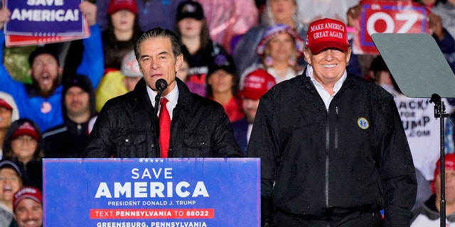 Pennsylvania Senate candidate Mehmet Oz, left, accompanied by former President Donald Trump speaks at a campaign rally in Greensburg, Pa., Friday, May 6, 2022. 
