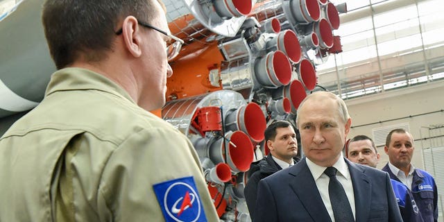 Russian President Vladimir Putin speaks with Roscosmos space agency employees at a rocket assembly factory during his visit to the Vostochny cosmodrome outside the city of Tsiolkovsky, about 200 kilometers (125 miles) from the city of Blagoveshchensk in the far eastern Amur region Tsiolkovsky , Russia, Tuesday, April 12, 2022. 