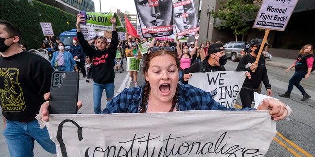 Demonstrators march down the streets after protesting outside of the U.S. Courthouse in response to a leaked draft of the Supreme Court's opinion to overturn Roe v. Wade, in Los Angeles, Tuesday, March 3, 2022.