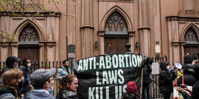 Abortion-rights activists gather outside of a Catholic church in downtown Manhattan to voice their support for a woman's right to choose on May 07, 2022 in New York City. 