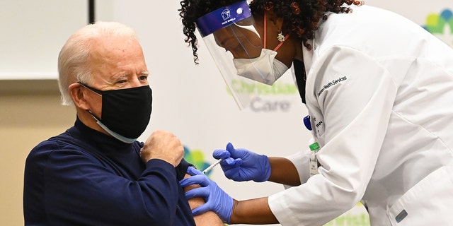 Nurse Practitioner Tabe Mase gives Joe Biden his first dose of the coronavirus vaccine on December 21, 2020.