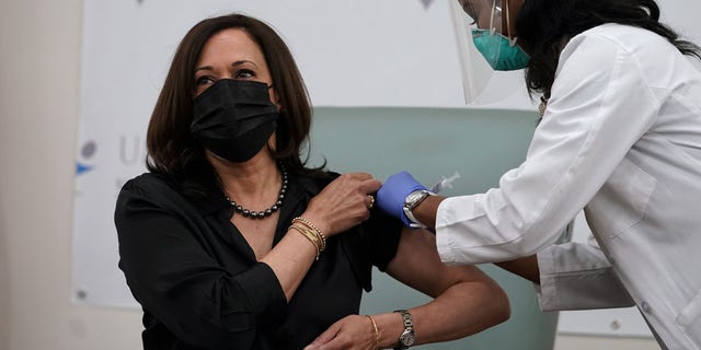 Kamala Harris receives the Moderna COVID-19 vaccine from nurse Patricia Cummings, Tuesday Dec. 29, 2020, at United Medical Center in southeast Washington.