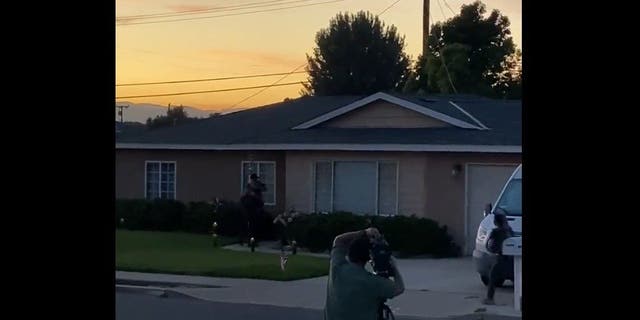 Video taken by neighbor David Burgett shows law enforcement officers executing a search warrant at the California home of Nicholas John Roske, who was charged Wednesday with attempted murder of Supreme Court Justice Brett Kavanaugh.
