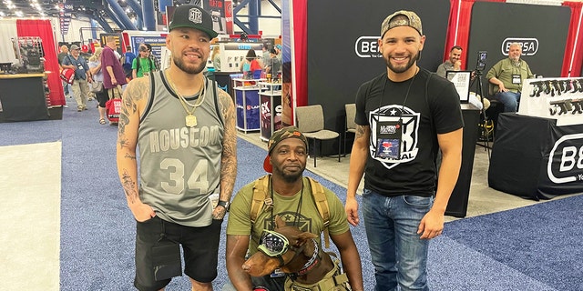 Jay Cee and friends attend the 2022 NRA convention with his dog Ace.