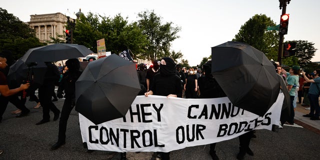 Antifa gathers outside the Supreme Court following the landmark ruling overturning Roe v. Wade.