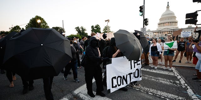 Antifa gathers outside the Supreme Court following the landmark ruling overturning Roe v. Wade.