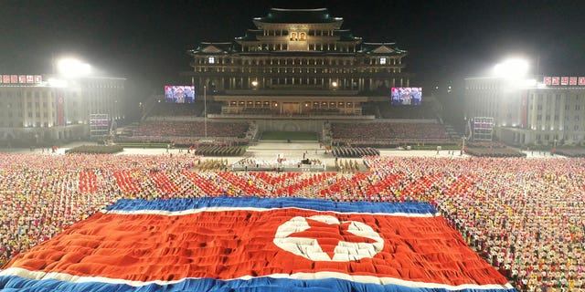 In this photo provided by the North Korean government, a huge North Korean flag is displayed during a celebration of the nation’s 73rd anniversary at Kim Il Sung Square in Pyongyang, North Korea, early Thursday, Sept. 9, 2021. Independent journalists were not given access to cover the event depicted in this image distributed by the North Korean government. The content of this image is as provided and cannot be independently verified. Korean language watermark on image as provided by source reads: "KCNA" which is the abbreviation for Korean Central News Agency. (Korean Central News Agency/Korea News Service via AP)