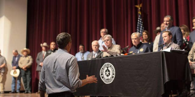 Democrat Robert "Beto" O’Rourke, who is running against Abbott for governor this year, interrupts a news conference headed by Texas Gov. Greg Abbott in Uvalde, Texas Wednesday, May 25, 2022.