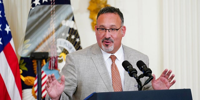 FILE: Education Secretary Miguel Cardona speaks during the 2022 National and State Teachers of the Year event in the East Room of the White House in Washington, April 27, 2022. 