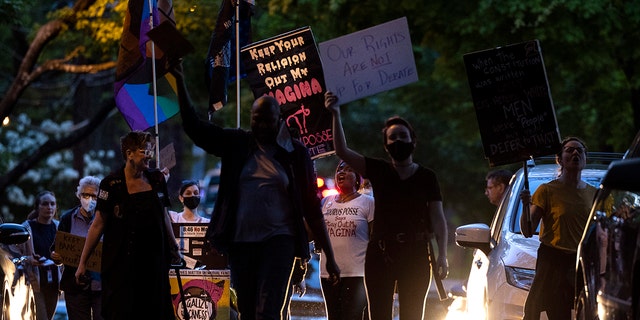 Abortion-rights advocates stage a protest outside the home of U.S. Associate Supreme Court Justice Brett Kavanaugh on May 11, 2022, in Chevy Chase, Maryland. 