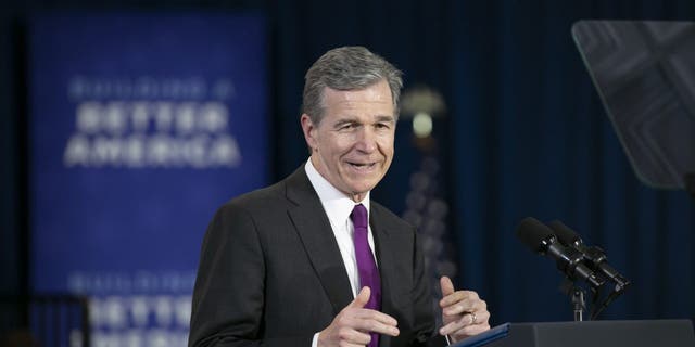 North Carolina Governor Roy Cooper speaks  before President Joe Biden speaks to guests during a visit to North Carolina Agricultural and Technical State University on April 14, 2022 in Greensboro, North Carolina.