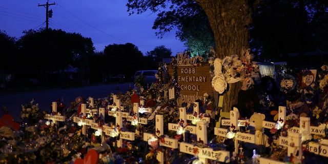 Wooden crosses are placed at a memorial dedicated to the victims of the mass shooting at Robb Elementary School June 3, 2022, in Uvalde, Texas. Nineteen students and two teachers were killed May 24.