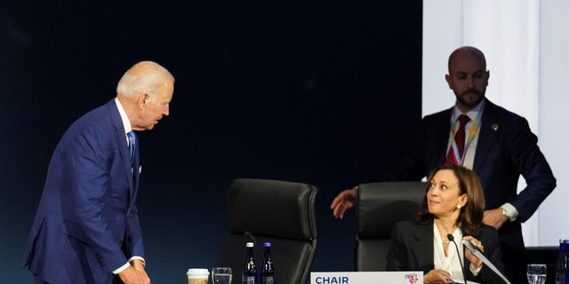 U.S. President Biden speaks with Vice President Kamala Harris during the opening session at the Ninth Summit of the Americas in Los Angeles June 9, 2022. 